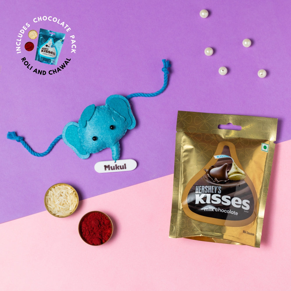 Boy Hanging with Personalised Rakhi, Chocolates, Roli and Chawal | Rakhi Hamper