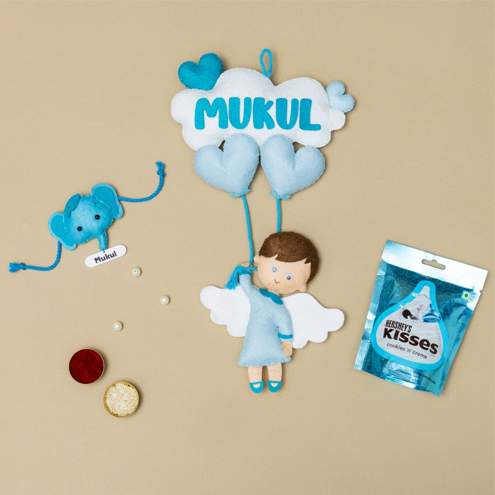 Boy Hanging with Personalised Rakhi, Chocolates, Roli and Chawal | Rakhi Hamper