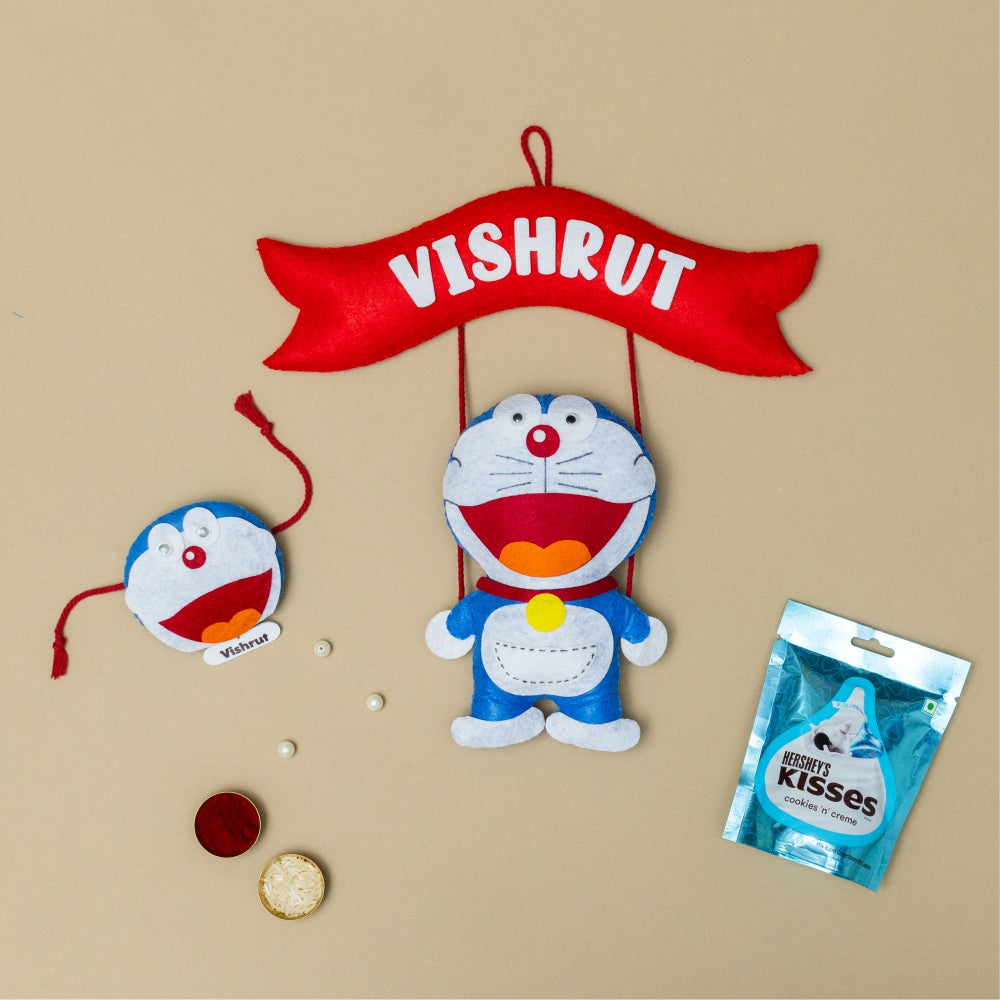 Doraemon Hanging with Personalised Rakhi, Chocolates, Roli and Chawal | Rakhi Hamper