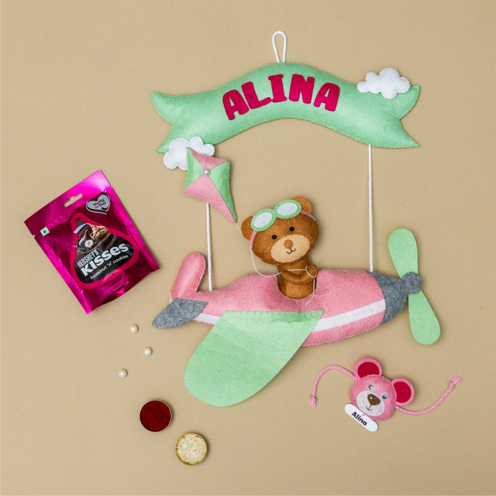 Riding Plane Pink with Personalised Rakhi, Chocolates,Roli and Chawal | Rakhi Hamper