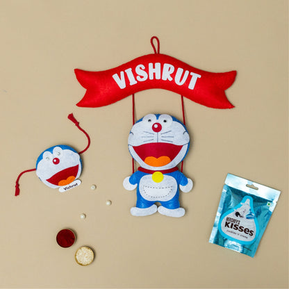 Doraemon Hanging with Personalised Rakhi, Chocolates, Roli and Chawal | Rakhi Hamper