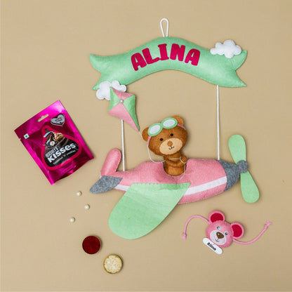 Riding Plane Pink with Personalised Rakhi, Chocolates,Roli and Chawal | Rakhi Hamper